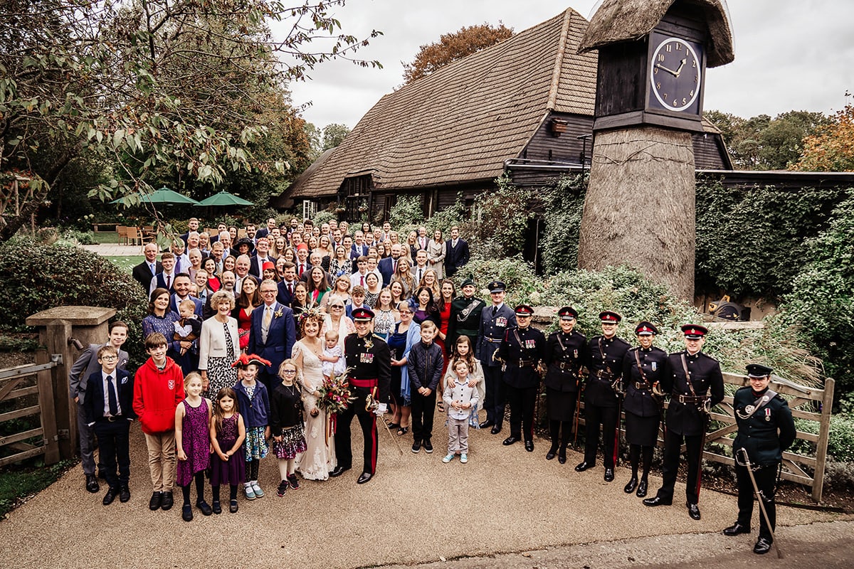 whole group photo clock barn wedding