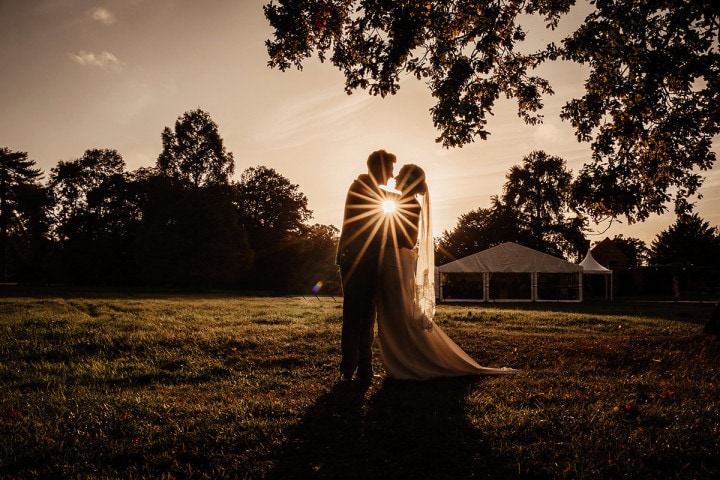 bride and groom silhouette sunset