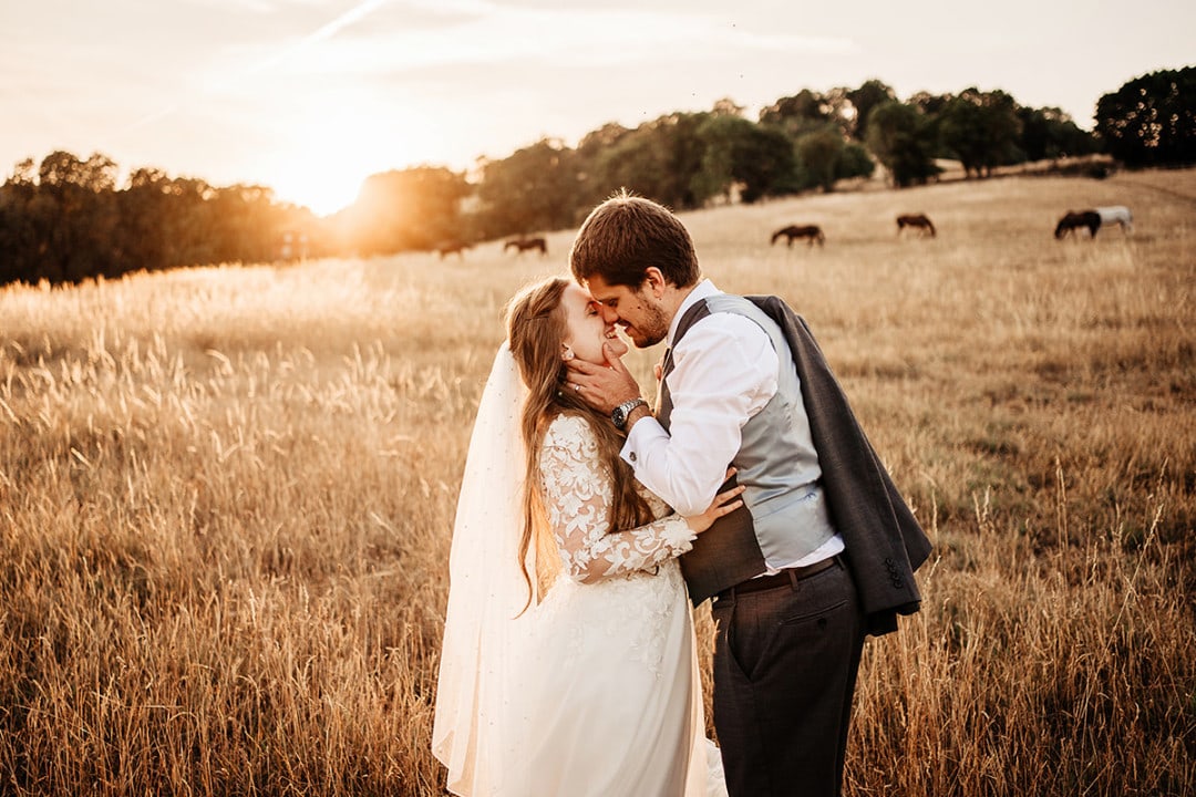 Golden hour wedding photos at Old Luxters Barn