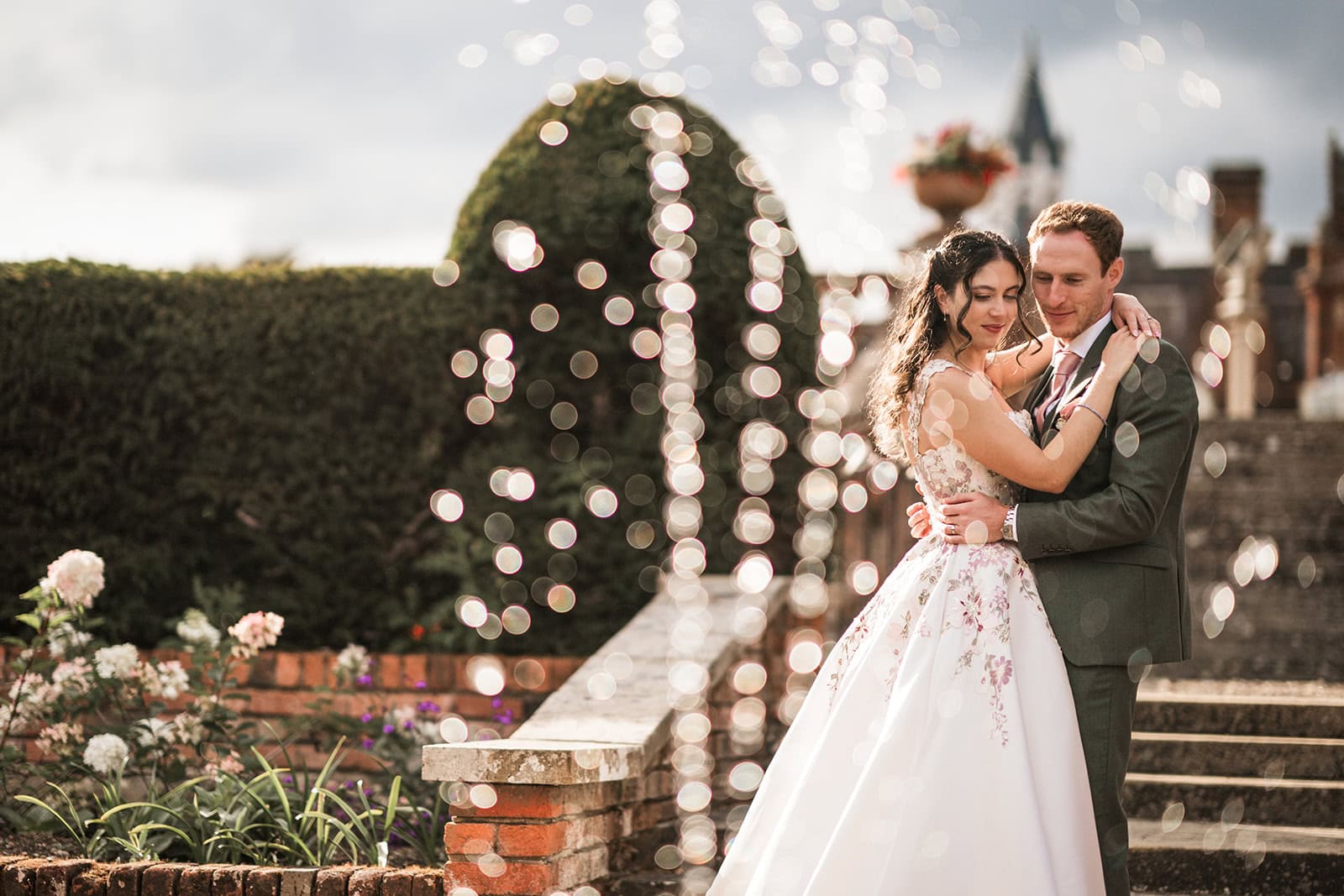 Wedding couple dancing outdoors at sunset, romantic photography.